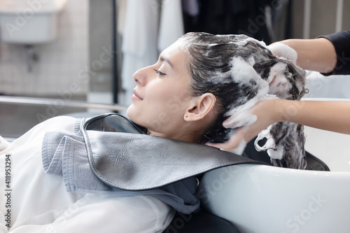 Woman getting her Hair Washed and Massaged  in a Beauty Salon