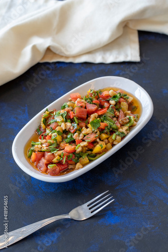 Wallpaper Mural Healthy vegetarian food, traditional flavor Gavurdagi Salad with walnut. coban or choban salad. Mezze served alongside the main course. Appetizer Torontodigital.ca