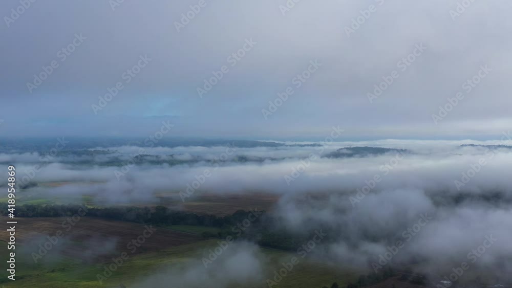tropical mysterious atmosphere with clouds over a jungle and farm fields aerial Costa Rica tropical mysterious atmosphere with clouds over a jungle and farm fields aerial Costa Rica