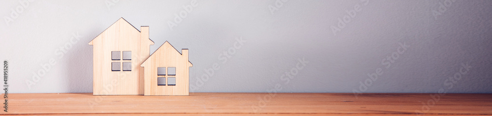 wooden house models on table wooden house models on table