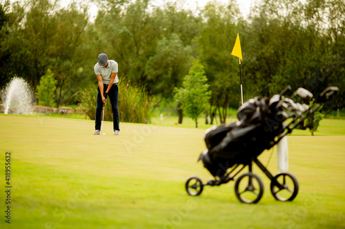 Young man playing golf