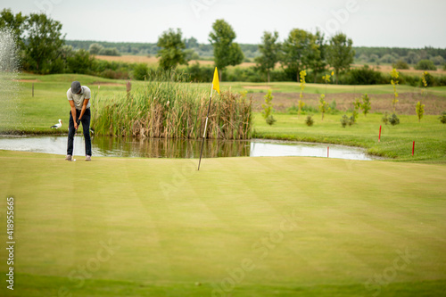 Young man playing golf