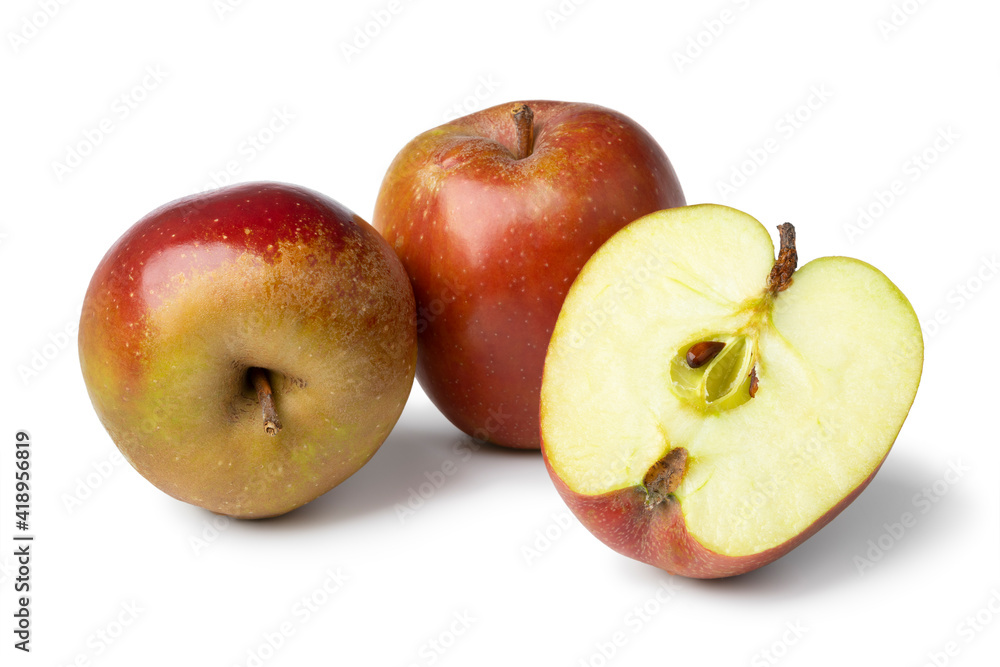 Whole and halved Belle de Boskoop or Goudreinet apple close up isolated on white background Whole and halved Belle de Boskoop or Goudreinet apple close up isolated on white background