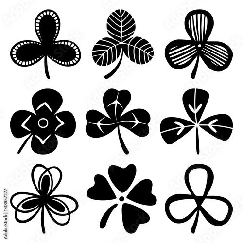 Set of clover or trefoil or shamrock leaves, St Patrick Day symbol. Silhouette vector illustrations isolated on the white background. © Elena