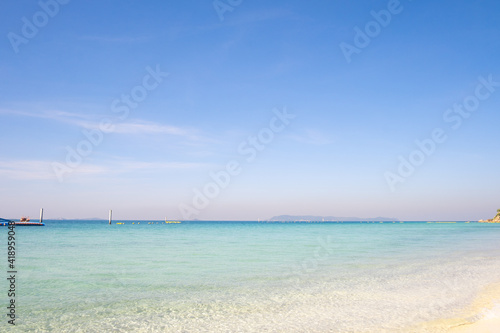 Beautiful sea beach with blue sky and sea water © Chatchawarn