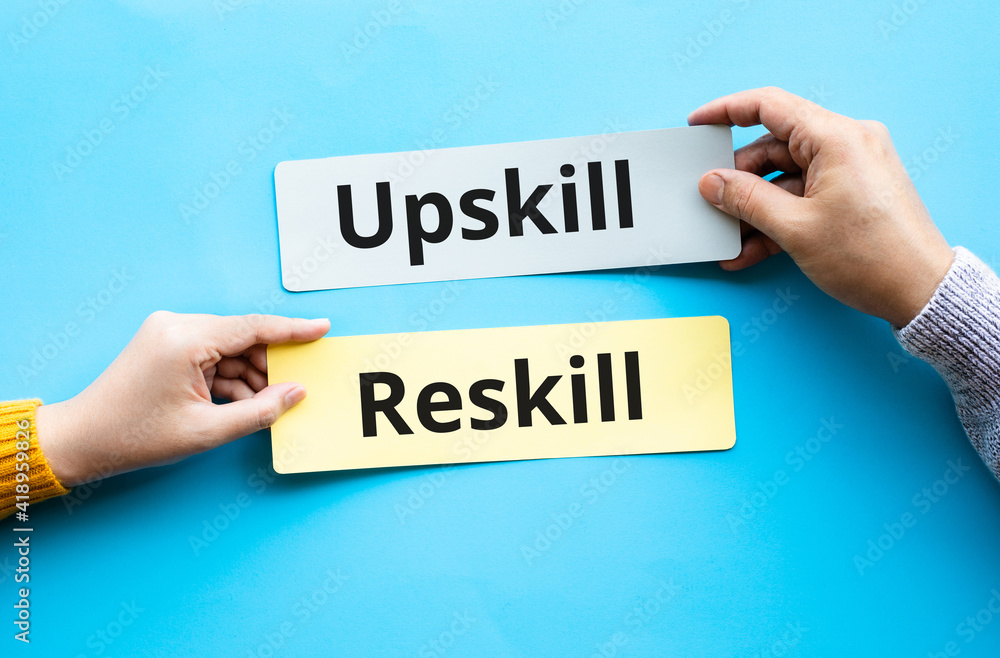 Up skill and re skill text on bubble paper.performance or development of person concepts Up skill and re skill text on bubble paper.performance or development of person concepts