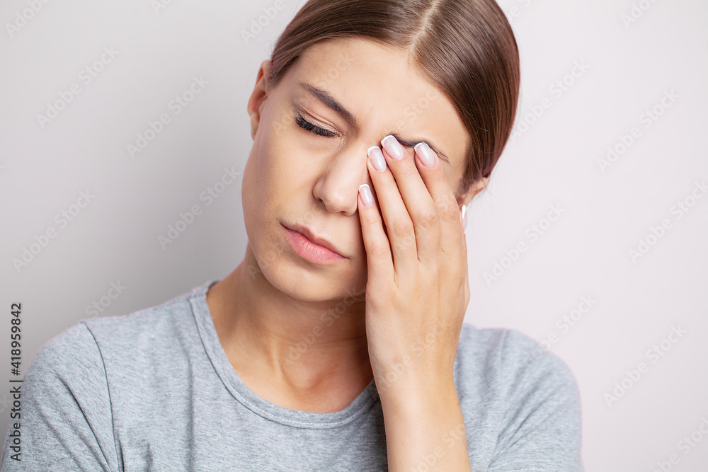 Portrait of a beautiful sick girl suffering from migraines, feelings of pressure and stress. Portrait of a beautiful sick girl suffering from migraines, feelings of pressure and stress.