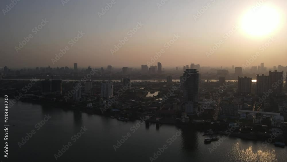 Slow drone overview above the Mekong river at sunset time over Phnom Penh city, Cambodia 3-3 Slow drone overview above the Mekong river at sunset time over Phnom Penh city, Cambodia 3-3