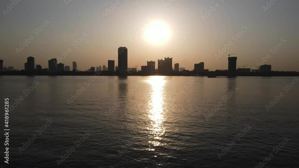 Slow drone overview above the Mekong river at sunset time over Phnom Penh city, Cambodia 1-3 Slow drone overview above the Mekong river at sunset time over Phnom Penh city, Cambodia 1-3
