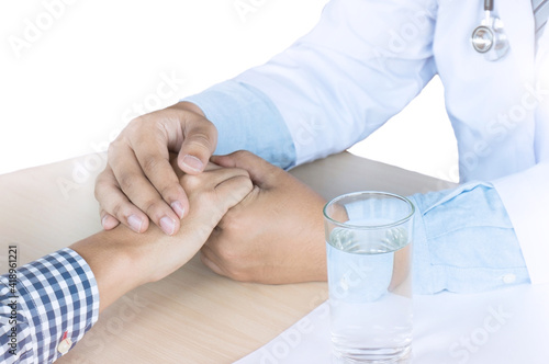 Medical doctor holding patient's hands and comforting her with care, Doctor supports her palliative patient with sympathy. (Selective Focus)