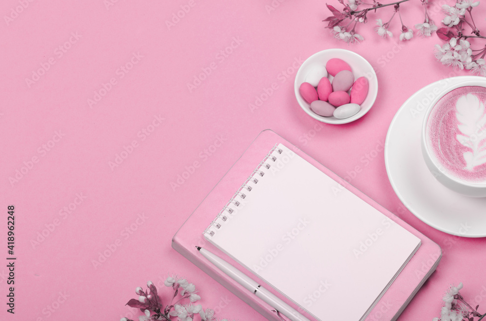 Creative flat lay of workspace desk, notepad and lifestyle objects on pink background Creative flat lay of workspace desk, notepad and lifestyle objects on pink background
