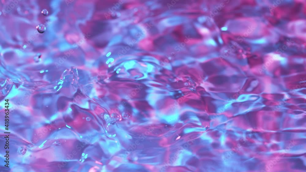 Super slow motion of splashing water wave illuminated by neon lights. Filmed on high speed cinema camera, 1000 fps. Super slow motion of splashing water wave illuminated by neon lights. Filmed on high speed cinema camera, 1000 fps.