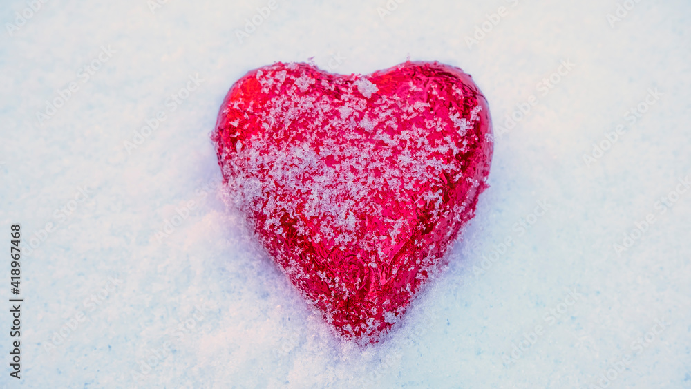 Red Valentine's heart in the snow Red Valentine's heart in the snow