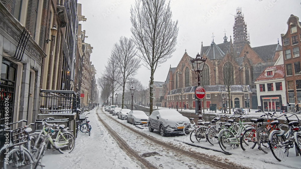 Snowy city Amsterdam in the Netherlands in winter