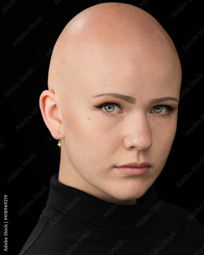 Fototapeta premium Young urban woman with blue eyes and a fair complexion poses for the camera.