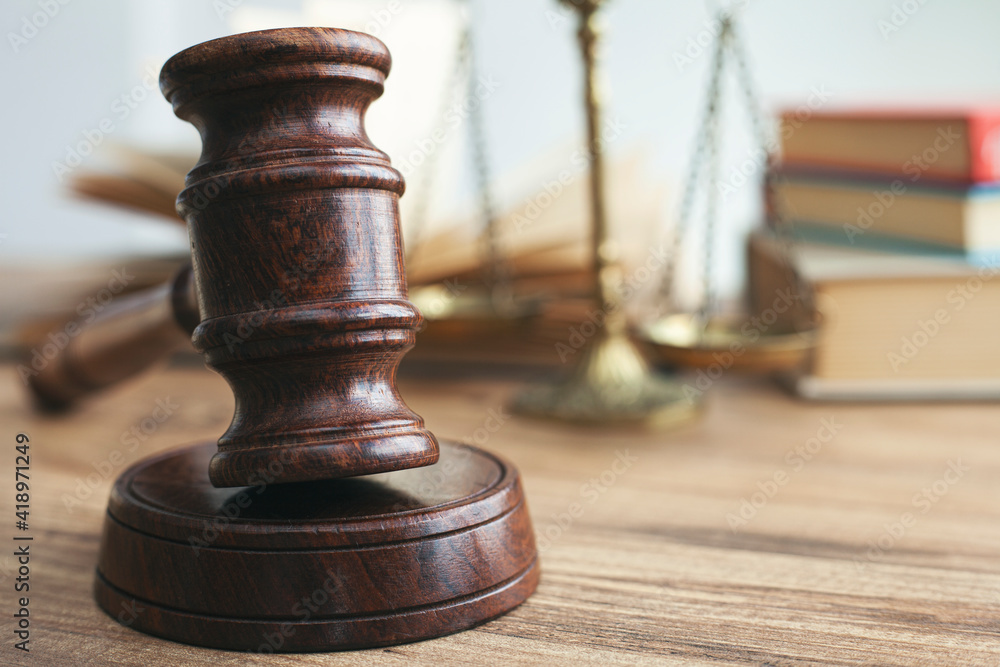 Justice legal and jurisprudence concept. Law books on lawyer desk at law firm. Justice legal and jurisprudence concept. Law books on lawyer desk at law firm.