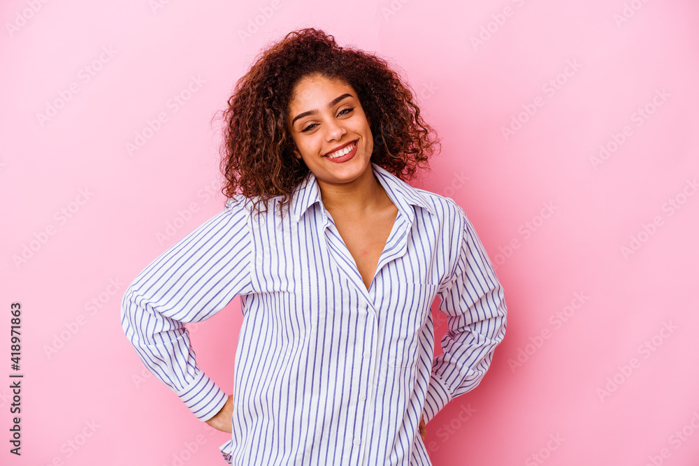Young african american woman isolated on pink background happy, smiling and cheerful. Young african american woman isolated on pink background happy, smiling and cheerful.