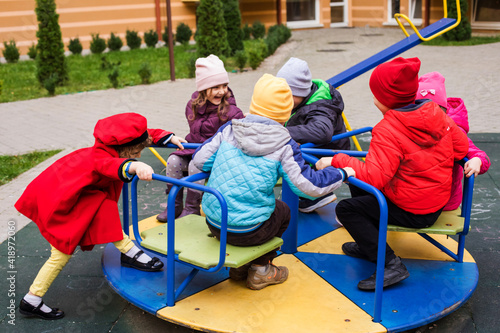 The sad little girlfriends in the playground during quarantine