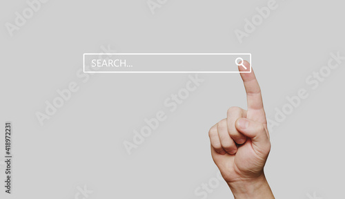 Search bar internet data browser. The hand presses the information search button.