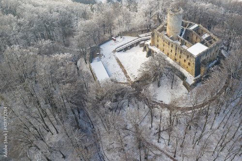 Aerial view of Lipowiec castle. Historic castle Lipowiec and antique building museum. The ruins of the top of the mountain. Winter time.