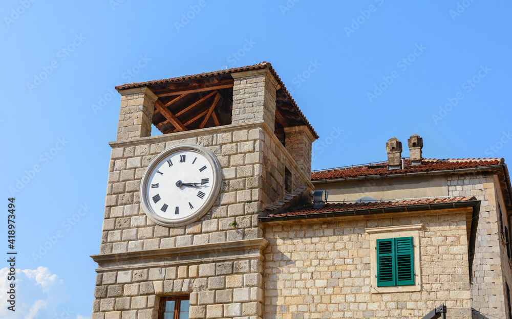 Clock tower in the Old Town of Kotor. Armory Square. Montenegro