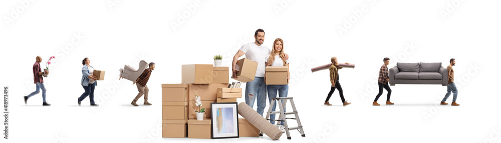Young couple with a pile of cardboard boxes packing for home removal and other people in the back carrying items Young couple with a pile of cardboard boxes packing for home removal and other people in the back carrying items