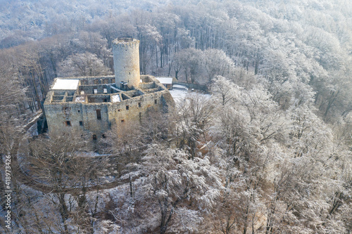 Aerial view of Lipowiec castle. Historic castle Lipowiec and antique building museum. The ruins of the top of the mountain. Winter time.