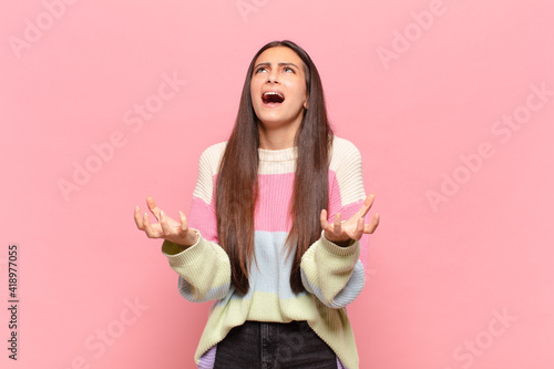 Fotografie young pretty woman looking desperate and frustrated, stressed, unhappy and annoy