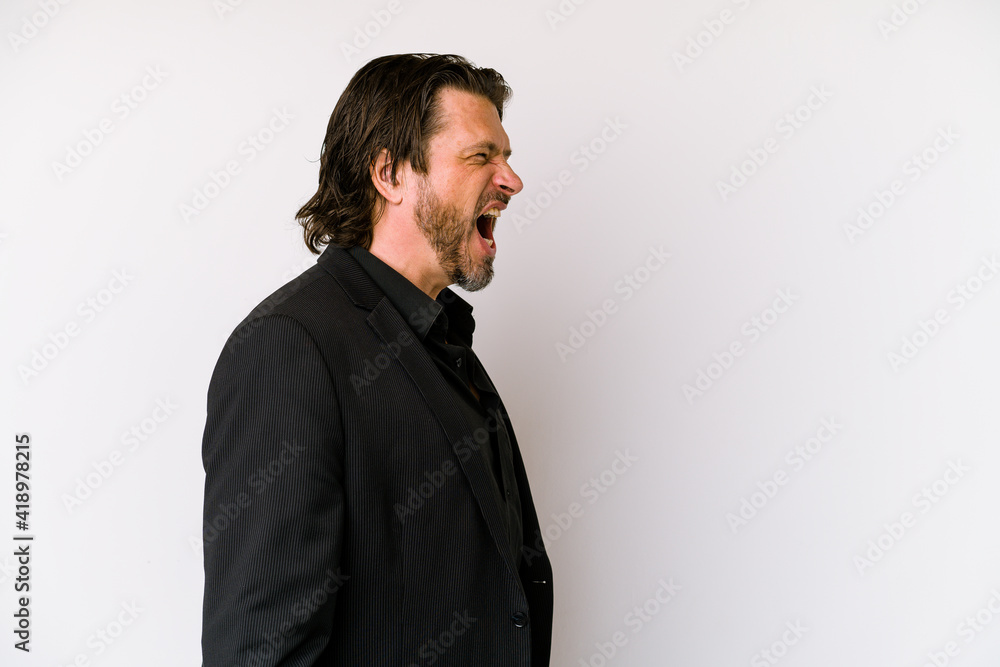 Fototapeta premium Middle age business dutch man isolated on white background shouting towards a copy space
