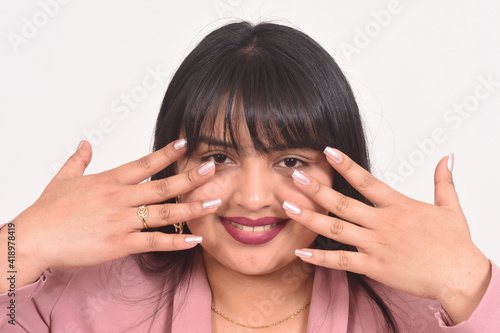 woman showing fingernails on white background