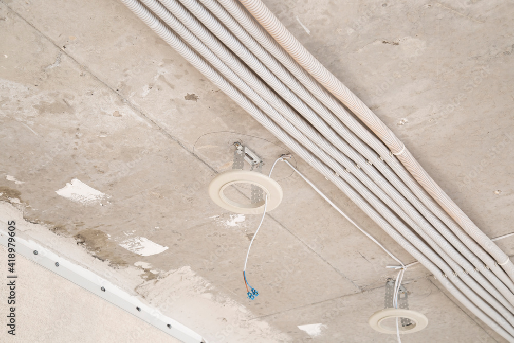 Fototapeta premium Installation of electrical equipment in a new apartment.Repair of electrical equipment.