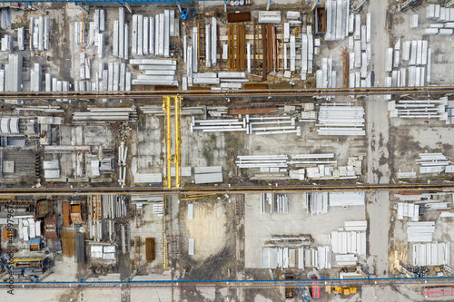 Industrial zone from above. Aerial view of storage place. Construction materials. Steel materials. Top view. © Curioso.Photography