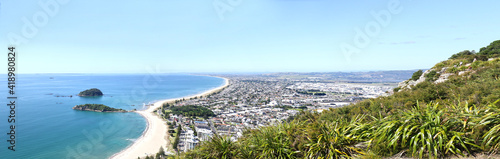 Tauranga, New Zealand. Panoramic view from Mount Maunganui of the white sand beach and City. Tauranga is a major cruise ship destination on northern island of New Zealand