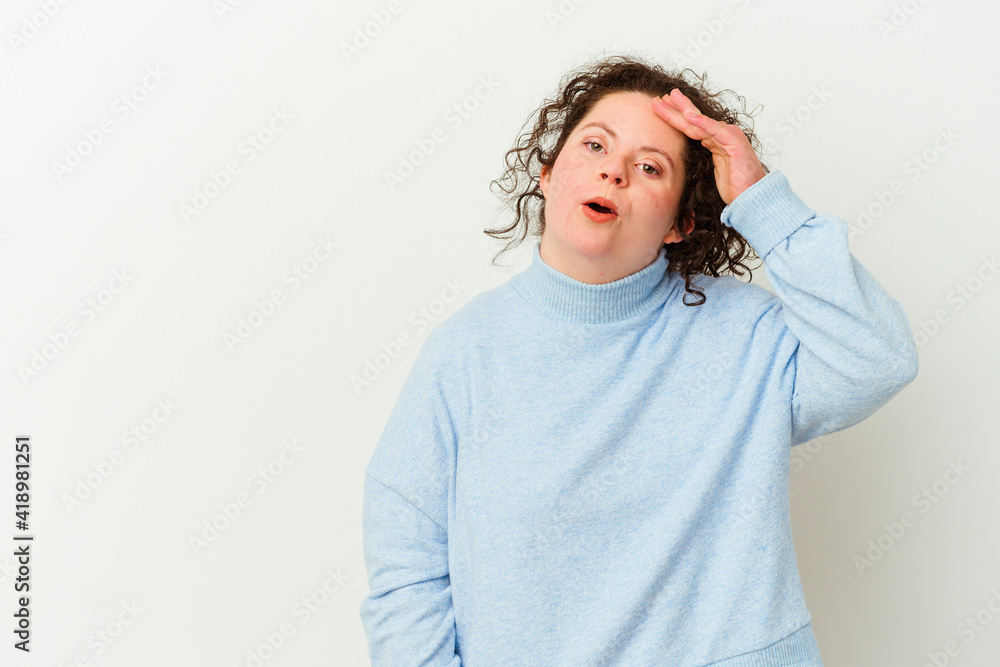 Woman with Down syndrome isolated shouts loud, keeps eyes opened and hands tense. Woman with Down syndrome isolated shouts loud, keeps eyes opened and hands tense.