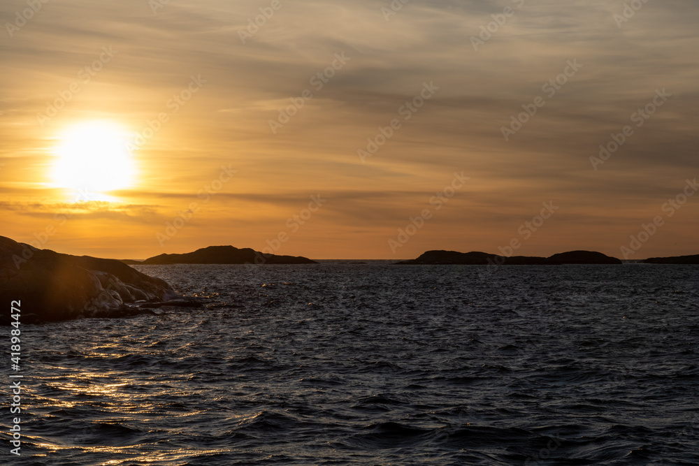 Fototapeta premium Sun sets in the Atlantic ocean. Shot in Sweden, Scandinavia