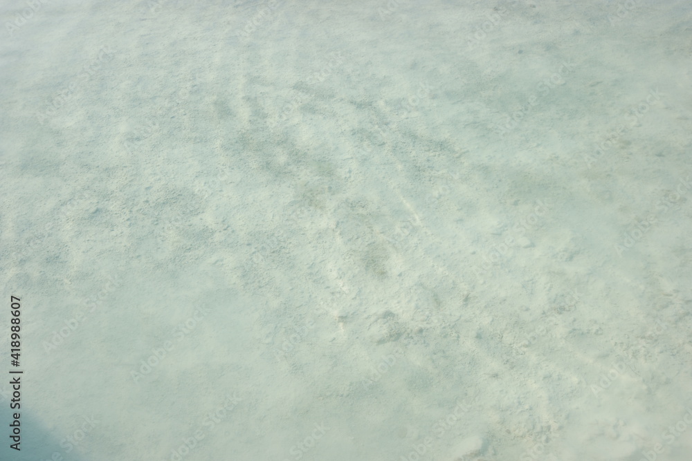 Water in natural travertine pool close up. Pool with clear hot water from thermal spring in Pamukkale, Turkey.