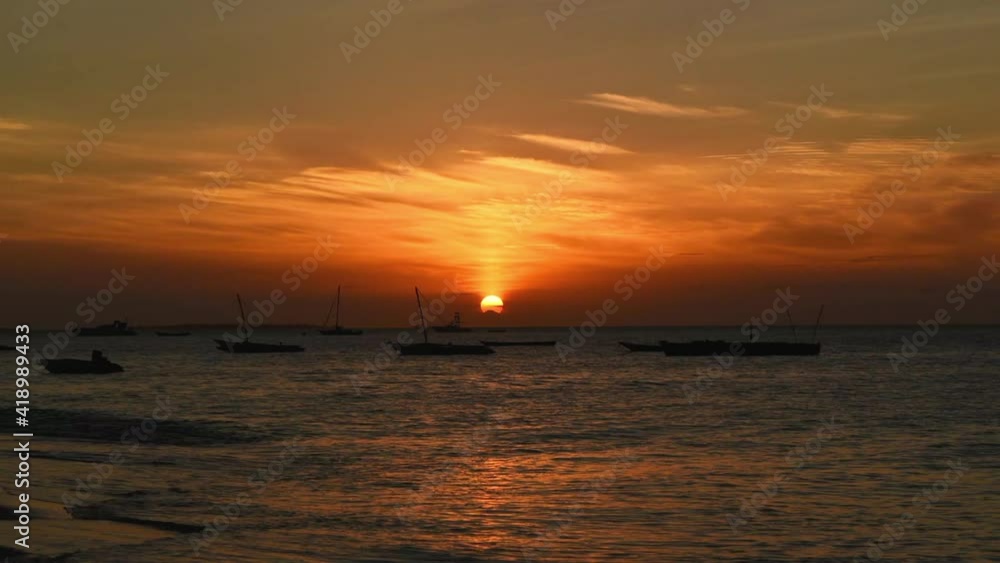 Time lapse of sunset at Zanzibar beach, Tanzania, static wide shot Time lapse of sunset at Zanzibar beach, Tanzania, static wide shot