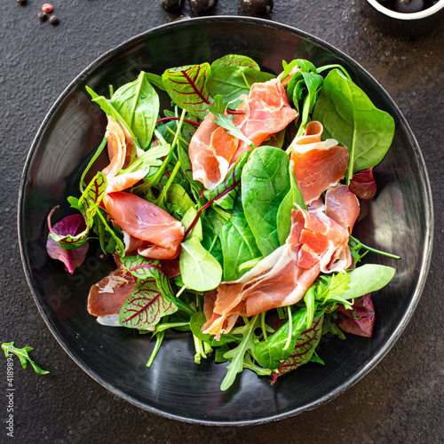 salad meat jamon prosciutto green leaves mix lettuce olives vegetables snack healthy meal top view copy space for text food background rustic image keto or paleo diet