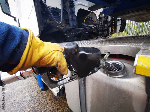 Semi Truck Being Refuelled with Diesel Close up photo