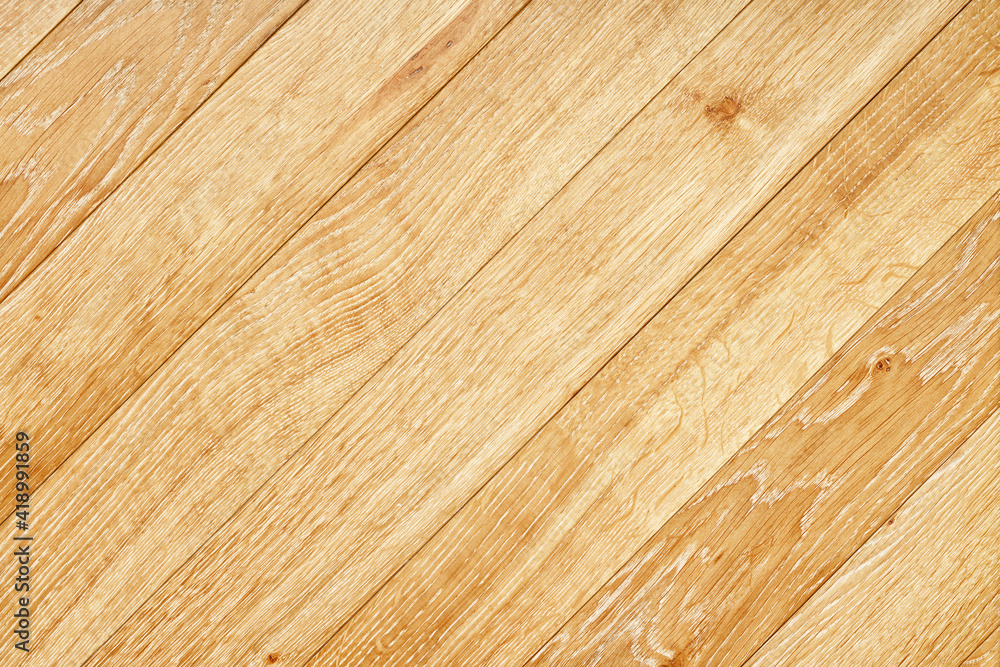 Fototapeta premium Beautiful texture of natural light oak planks arranged diagonally.