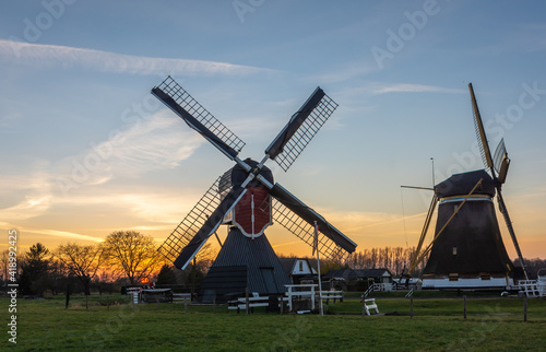 Two traditional dutch windmills by the sunset located in Oud-Zuilen, Province of Utrecht, The Netherlands