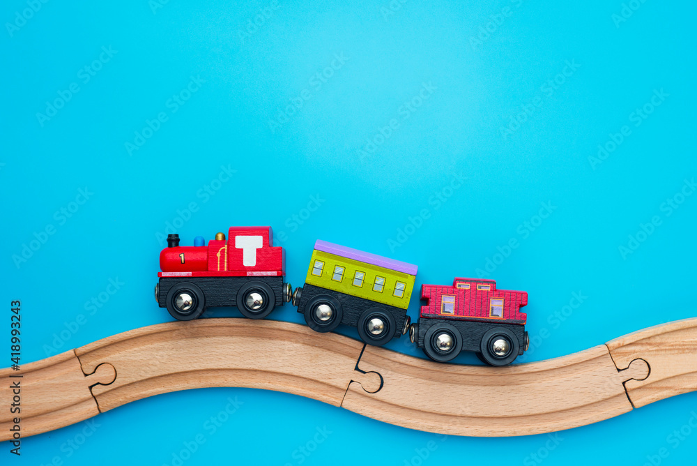 Toys background with copy space. Kids toy train with two carriages on