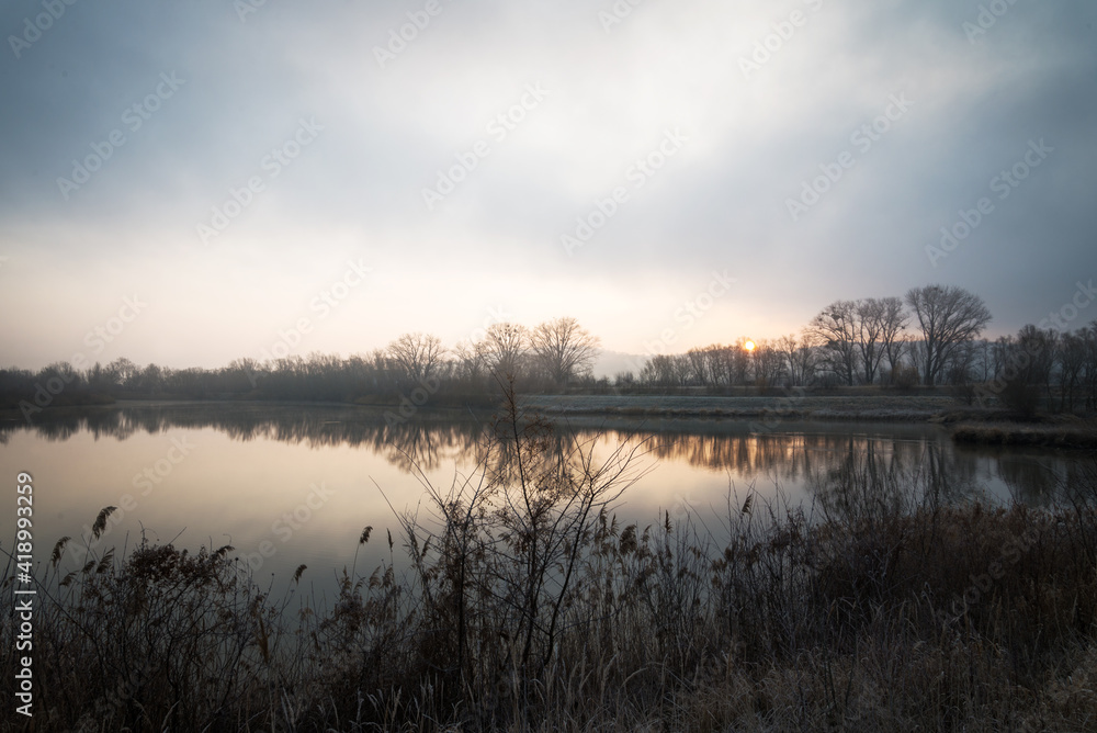 Fototapeta premium sunrise on a cold morning on the lake