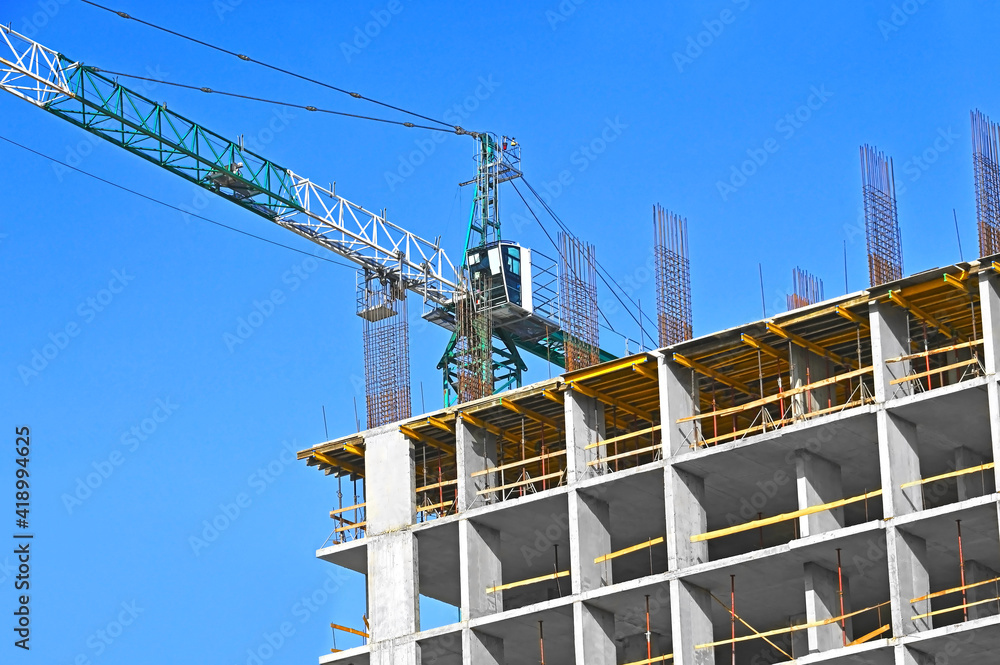 Crane and highrise construction site Crane and highrise construction site