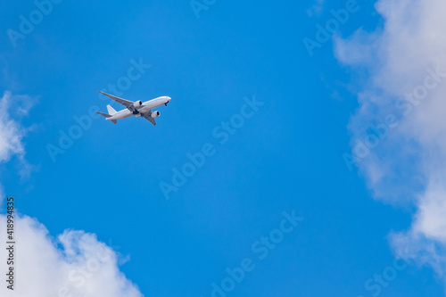 airplane white in the blue sky