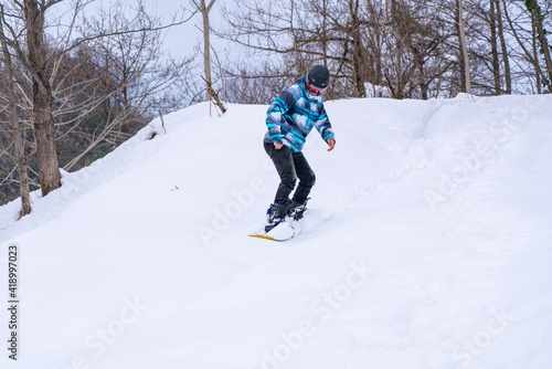 Man snowboarding in the mountains
