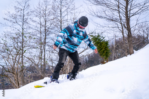 Man snowboarding in the mountains
