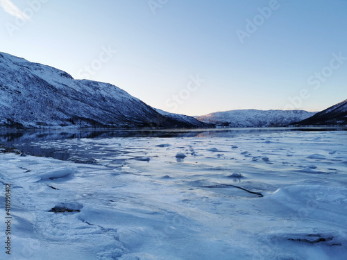 Snowy landscape in Kattfjorden, Tromso, Norway photo