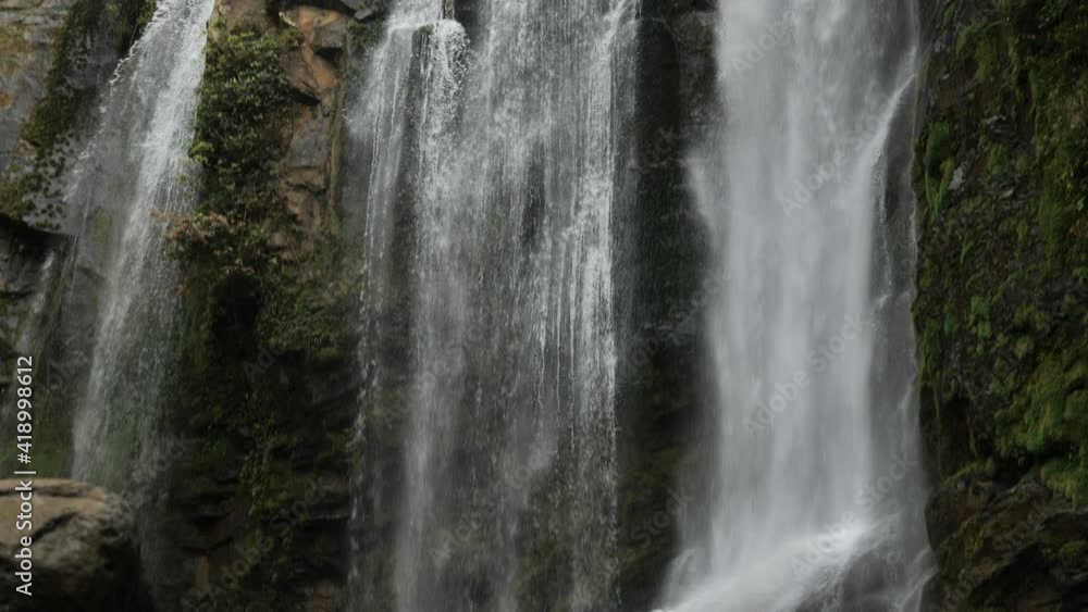 Slow motion of Nauyaca waterfalls Costa Rica following the water falling Slow motion of Nauyaca waterfalls Costa Rica following the water falling