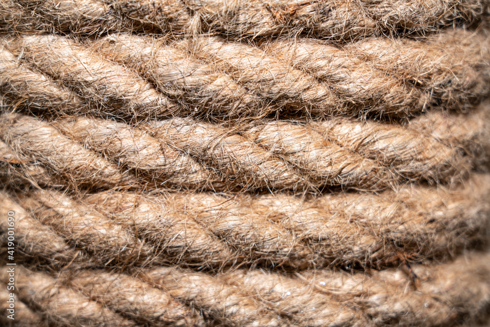 Brown rope coiled in layers as abstract background Brown rope coiled in layers as abstract background